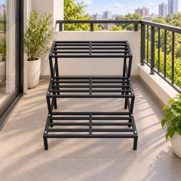 Empty 3 step black metal plant stand on a balcony